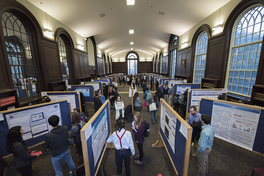 Overhead view of a research poster exhibition in the Wilbur Cross building