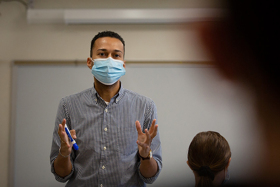 Professor Sean Forbes leads a class while wearing a mask